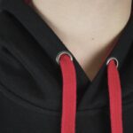 Close-up of red drawstrings and eyelets on black hood of Meenzer Fastnachtshoodie